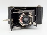 a black and white photo of an old camera