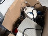 a box full of electronic equipment sitting on the ground