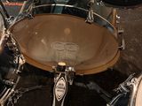 a close up view of a drum set with cymbas