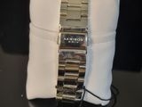 a watch that is sitting on a pillow on a table
