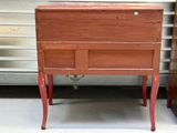 a small wooden cabinet with a drawer underneath it