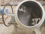 a cement mixer sitting in the middle of a construction site
