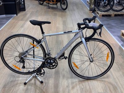 a bike that is sitting on the floor in a store