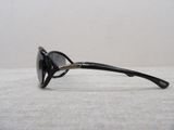 a pair of black sunglasses on a white surface