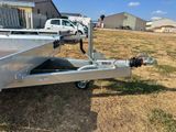 an image of a boat trailer parked in a field