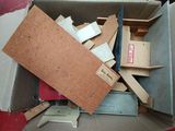 a cardboard box full of boxes and other items in it