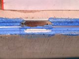 a close up of a piece of wood with a hole in it
