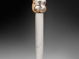 an image of a statue of a bear on a pole