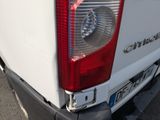 a close up of the tail light of a white truck
