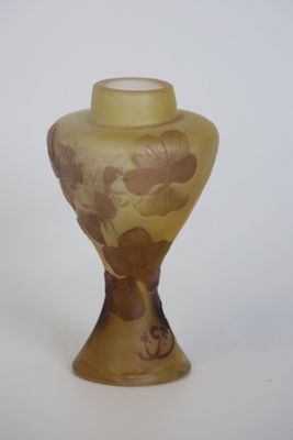 a glass vase with a floral design on it