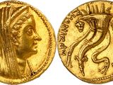 a gold coin with an image of a woman ' s head on it