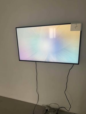 a flat screen tv mounted on the wall in a room