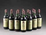 six bottles of wine are lined up in a row on a table