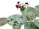a lot of plates that are sitting on a table