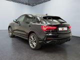 the rear end of a grey audi qx parked in a garage