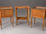 three pieces of furniture are sitting on a gray surface