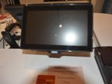 a laptop computer sitting on top of a desk next to a calculator