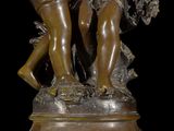 bronze statue of a woman and a child with a basket of flowers