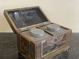 a small wooden box that has two bowls inside of it