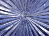 a close up of a glass plate with a logo on it