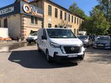 a white van that is parked in front of a building