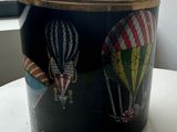 a black pot with a picture of hot air balloons on it