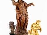 three wooden statues of jesus and a woman on a white background