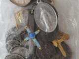 a bag of assorted coins and a key in it