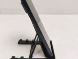 a cell phone that is sitting on a stand