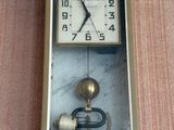 a clock that is hanging on the wall in the room