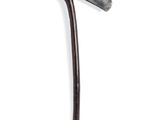 a small metal object with a long handle on a white surface