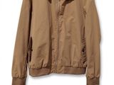 an image of a jacket hanging on a hanger on a wall