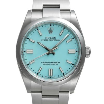 a close up of a wrist watch with a blue dial