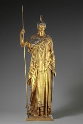 an image of a gold statue of a woman holding a staff