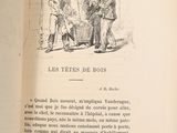 an open book with a picture of a man talking to a boy