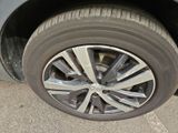 a close up of a car ' s tire on the street