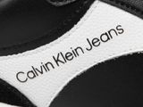 the black and white sneakers have a logo on the side