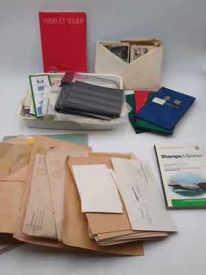 many papers, books, and other items on the table