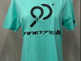 a green t - shirt with a black and white logo on it
