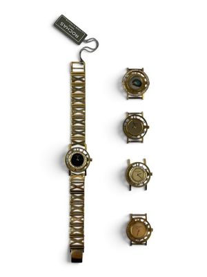 a watch that is sitting next to a bunch of other watches