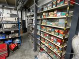 a room with a lot of shelves and tools in it