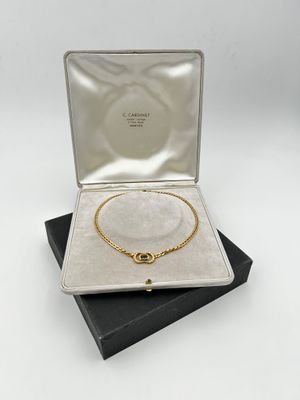 an open box with a necklace and bracelet in it