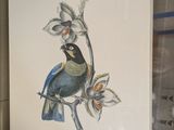 a picture of a bird sitting on a branch of a tree