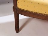 yellow upholstered upholstered chair with blue dots on it