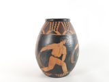 a vase that has a painting of a man on it