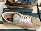 pair of men ' s puma sneakers on display in a shoe store