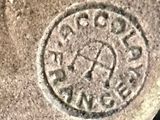a close up of a stone with a stamp on it