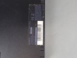 a black laptop with a bar code on the back