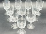 a lot of glasses that are sitting on a table
