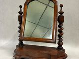 an image of a wooden mirror on a stand on a white background